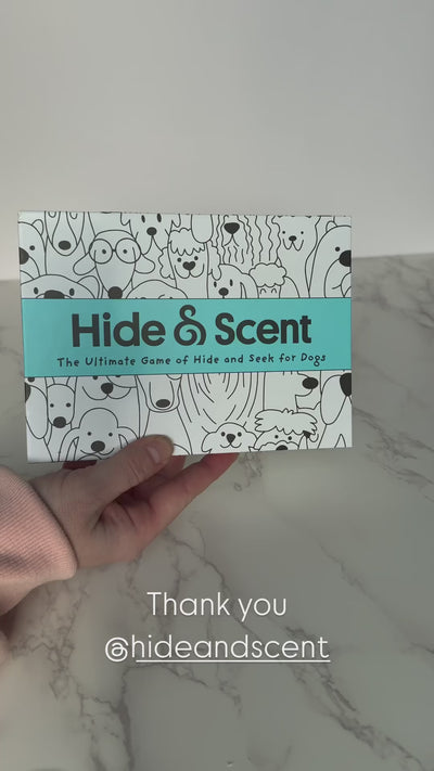 Close-up of the Hide&Scent game box with an influencer opening it to reveal the contents.